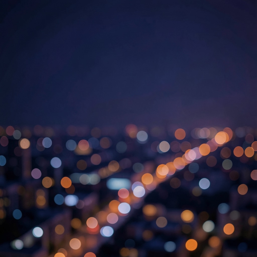 Generated background: a blurred night city with warm bokeh lights
